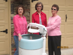 Janie, Jean, and Mother with Grandmother's wringer washer.