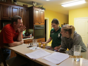 Greg keeping the girls company as Bree decorates the cake.